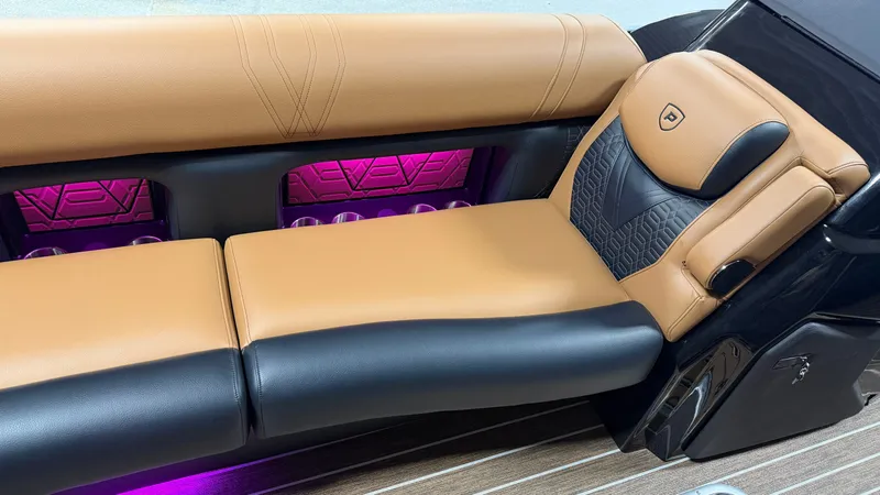 Slide: The Image of Luxurious boat seating with brown and black leather, purple lighting, and stylish design. - 17