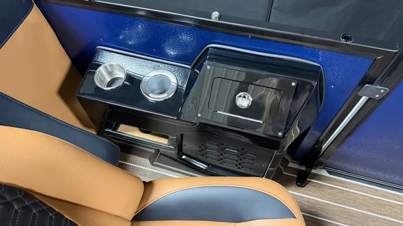 Slide: The Image of Interior of a Premier 250INTRIGUE with blue wall, brown seat, and cup holders. - 38