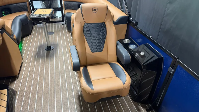 Slide: The Image of Luxurious seating in a modern boat with quilted pattern and cup holders. - 36