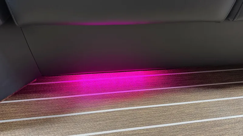Slide: The Image of A modern boat with stylish interior lighting and sleek wooden flooring. - 16
