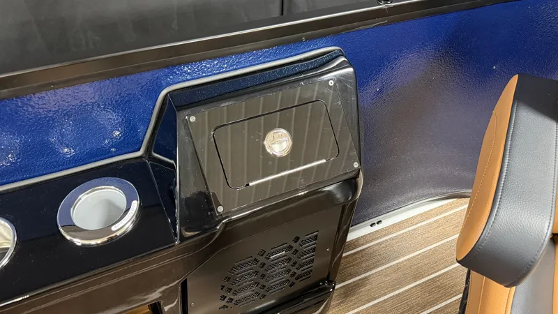 Slide: The Image of Interior of a 2027 Premier 250INTRIGUE with blue paneling and brown seating. - 28