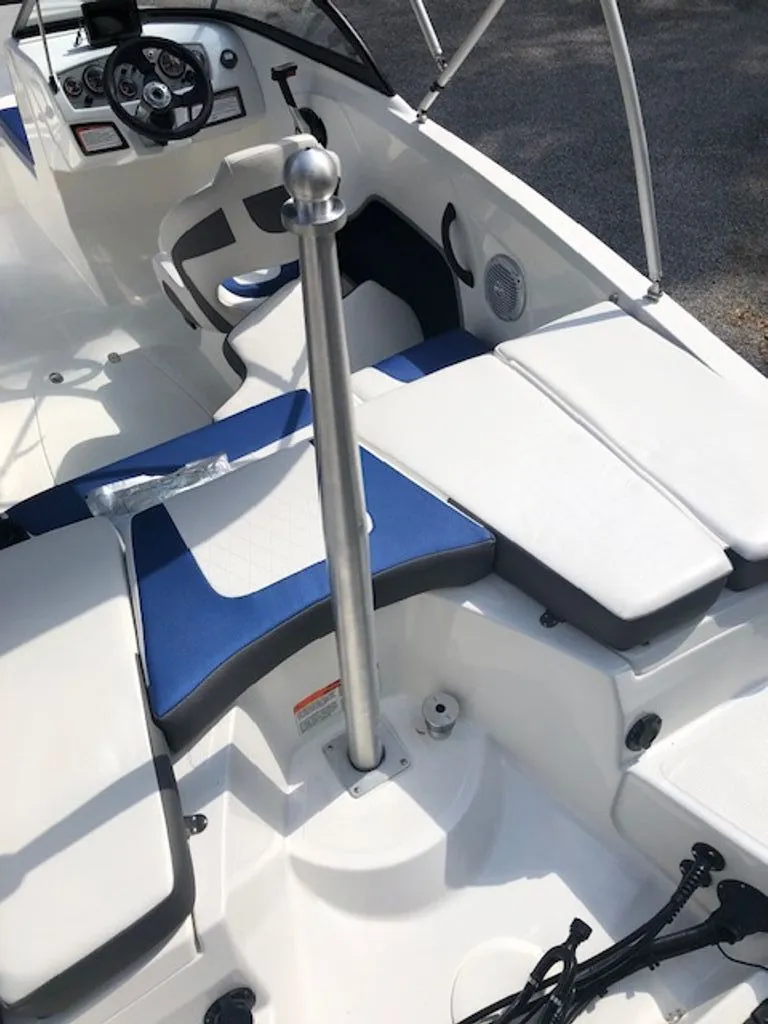 Slide: The Image of Interior of 2024 Tahoe 185 S boat with blue and white seating. - 11