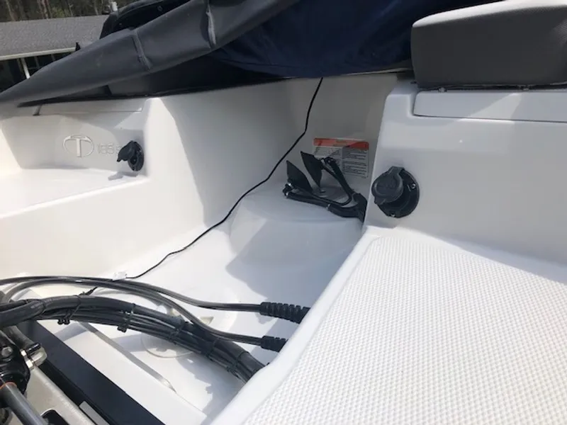 Slide: The Image of Interior of a 2024 Tahoe 185 S boat with cables and connectors. - 12