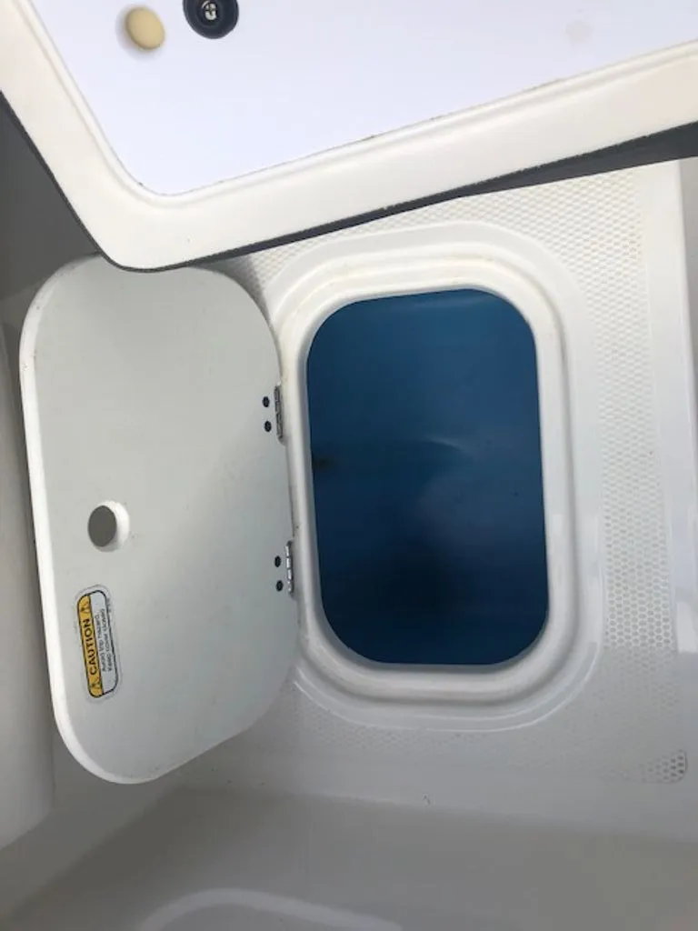 Slide: The Image of Interior view of 2024 Tahoe 185 S boat hatch. - 19