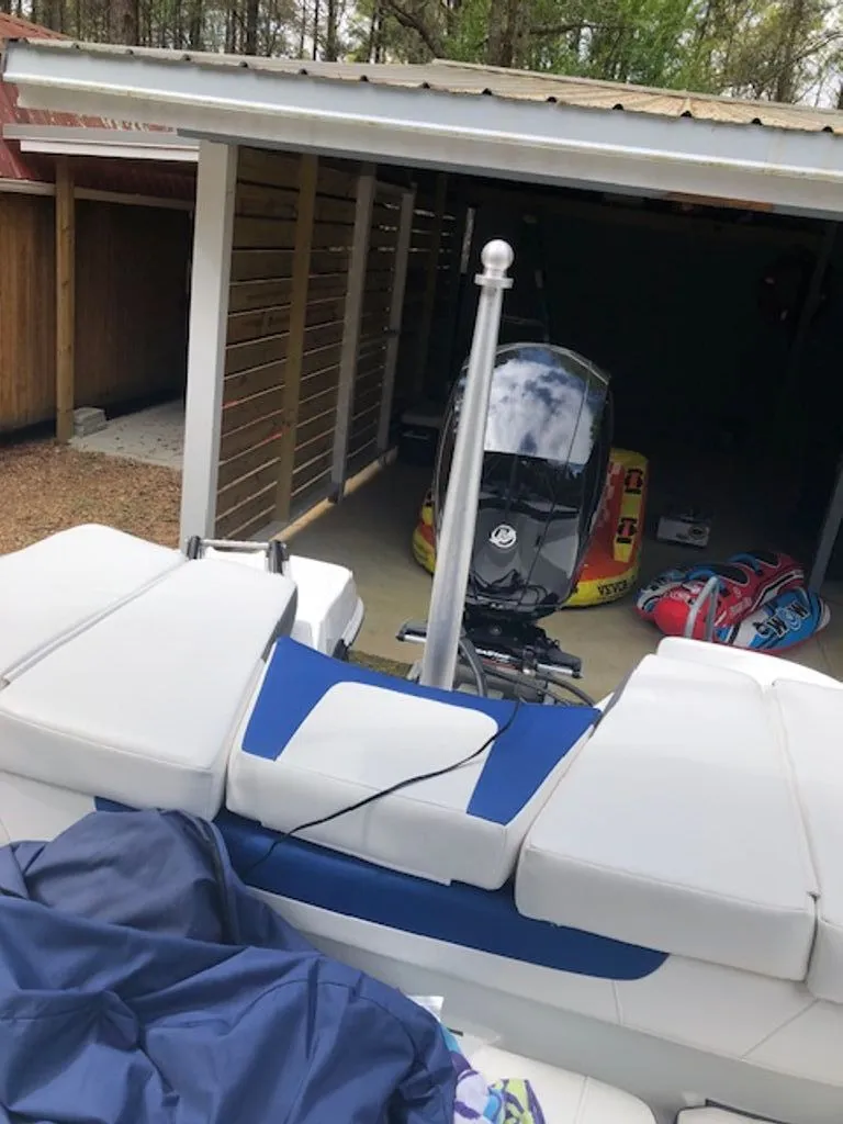 Slide: The Image of 2024 Tahoe 185 S boat parked in a garage. - 29