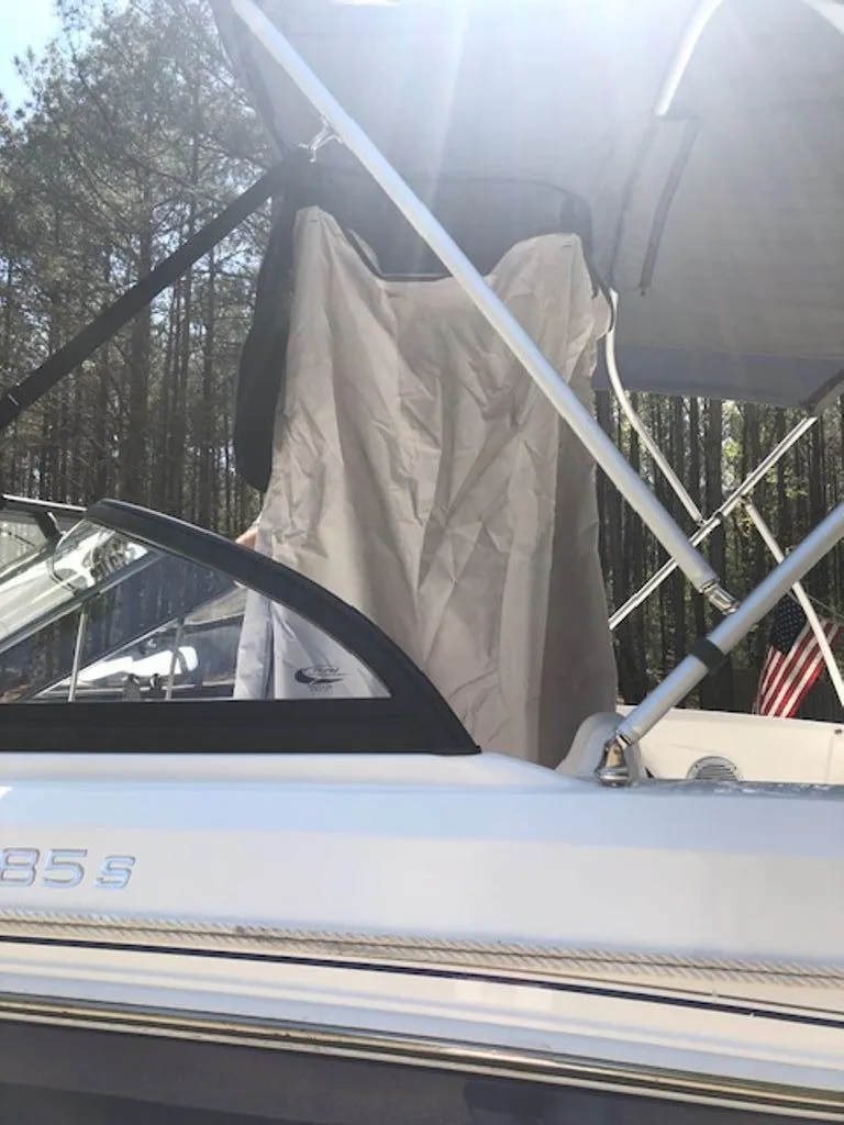 Slide: The Image of 2024 Tahoe 185 S boat with canopy in forest setting. - 30