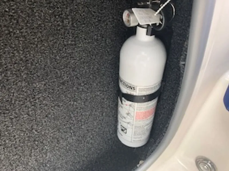 Slide: The Image of Fire extinguisher in 2024 Tahoe 185 S boat. - 37