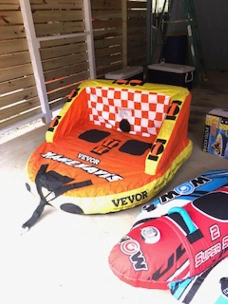 Slide: The Image of Inflatable water sport tubes in a garage, 2024 Tahoe 185 S model. - 39