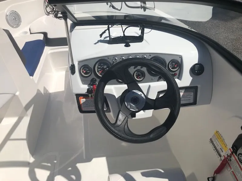 Slide: The Image of Interior view of 2024 Tahoe 185 S boat cockpit with steering wheel and gauges. - 4