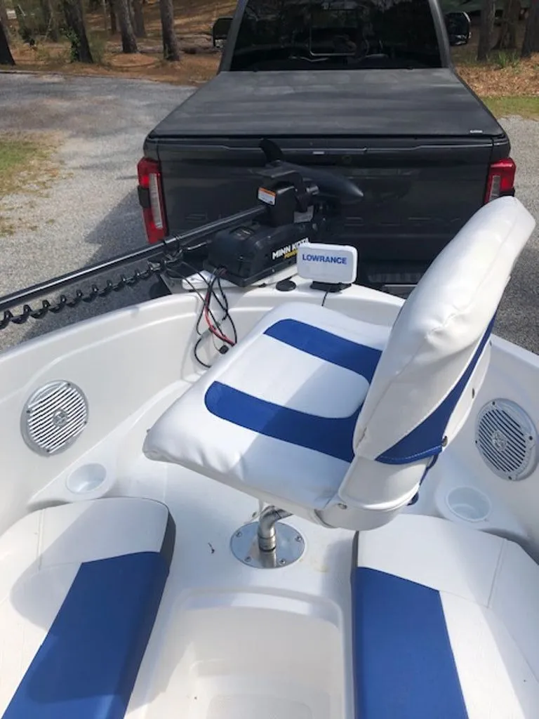 Slide: The Image of 2024 Tahoe 185 S boat with blue and white seats and electronics. - 8