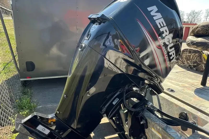 Slide: The Image of Mercury outboard motor on a 2015 Hurricane Sundeck boat. - 16