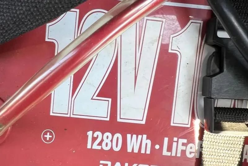 Slide: The Image of 12V battery with 1280 Wh capacity, close-up view. - 18