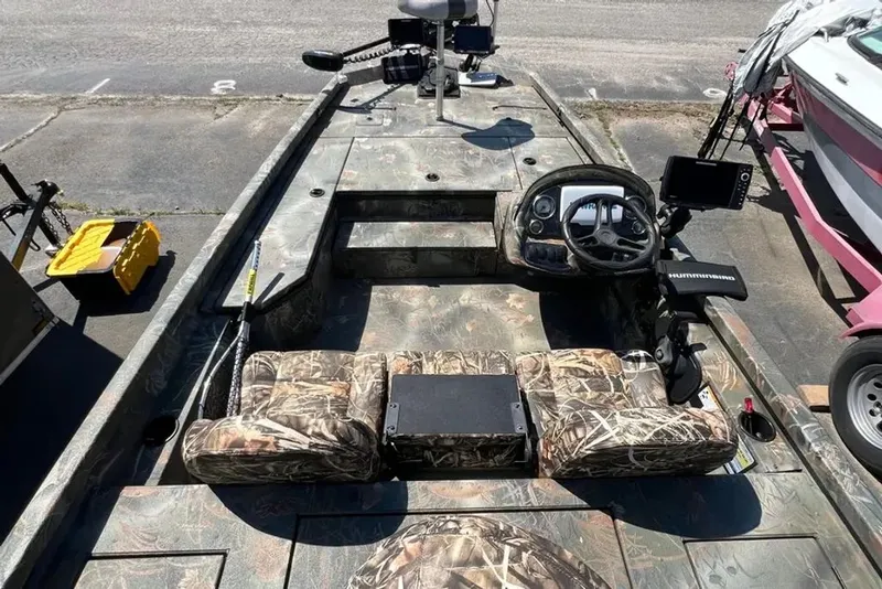 Slide: The Image of 2015 Hurricane Sundeck boat with camouflage pattern and steering console. - 6