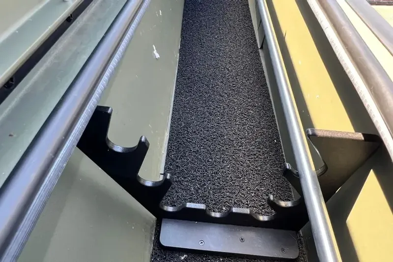 Slide: The Image of Interior view of a 2015 Hurricane Sundeck boat with rod holder. - 9