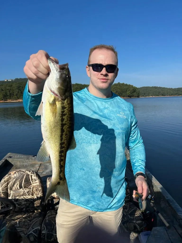 Slide: The Image of Angler holding fish on Triton 17 C TX boat, sunny day. - 22