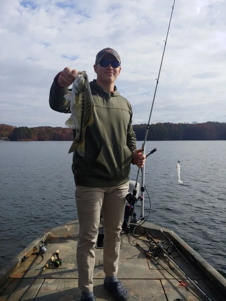 Slide: The Image of Angler on Triton 17 C TX boat holding caught fish. - 24