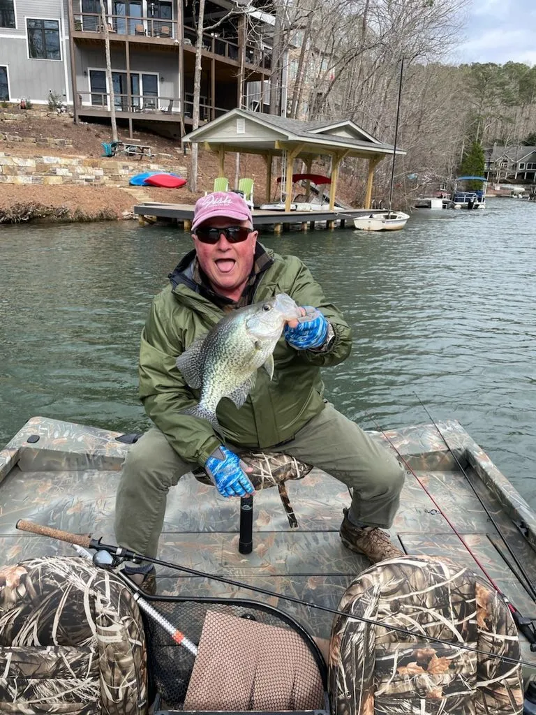 Slide: The Image of Angler on Triton 17 C TX boat holding large fish. - 26