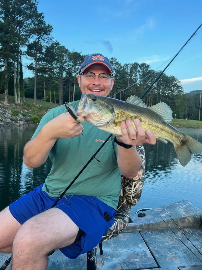 Slide: The Image of Angler holding fish on Triton 17 C TX boat, 2015 model. - 28