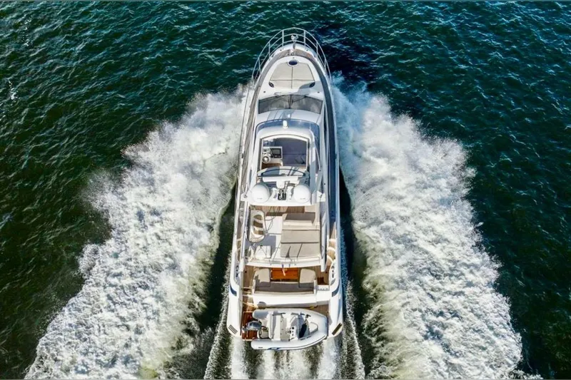Slide: The Image of Aerial view of 2016 Azimut 54 yacht cruising on open water. - 14