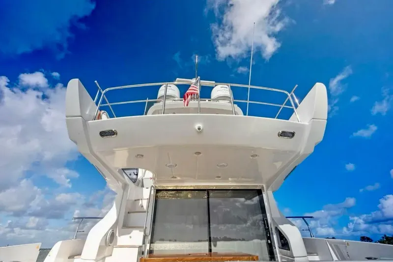 Slide: The Image of Luxury Azimut 54 yacht, 2016 model, against a vibrant blue sky. - 19