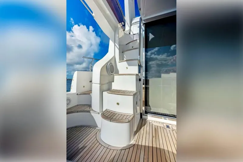 Slide: The Image of Staircase on 2016 Azimut 54 yacht with teak decking and clear sky background. - 21