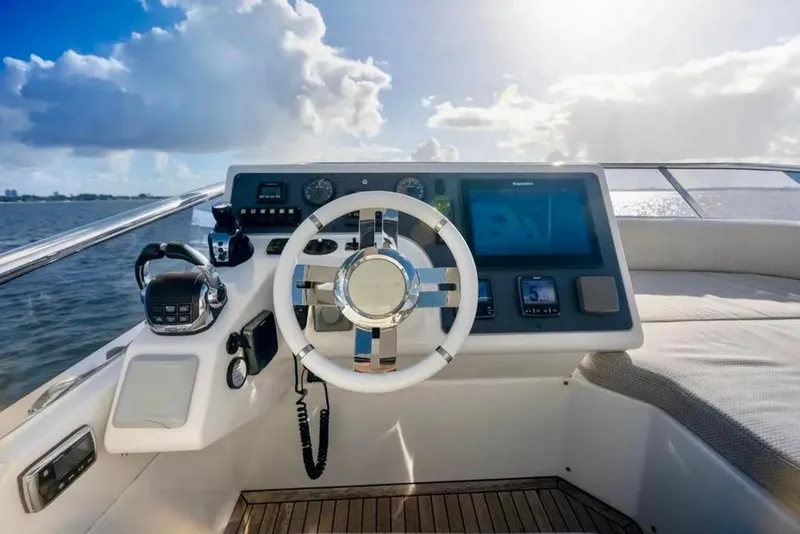 Slide: The Image of Helm of 2016 Azimut 54 yacht with modern controls and ocean view. - 24