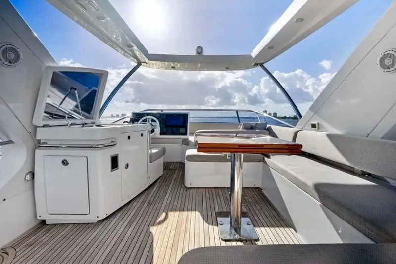 Slide: The Image of Luxurious interior of 2016 Azimut 54 yacht with modern seating and navigation area. - 28