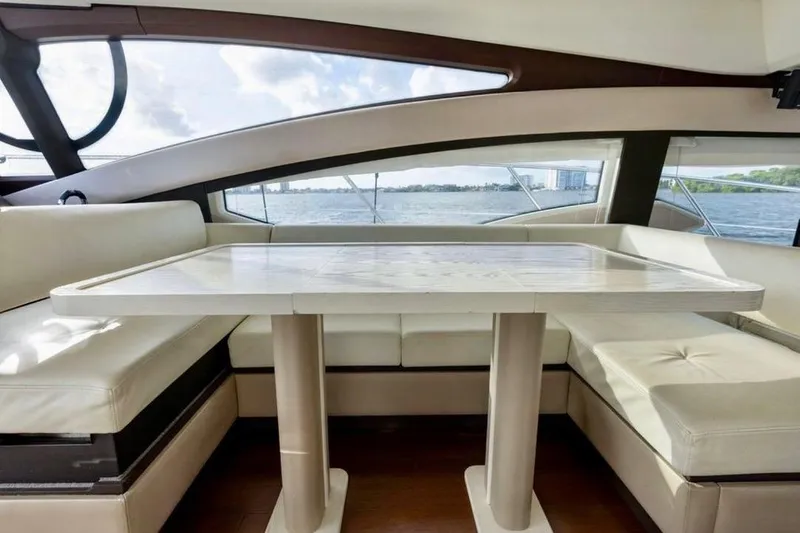 Slide: The Image of Luxurious interior of 2016 Azimut 54 yacht with elegant dining area and scenic water views. - 34