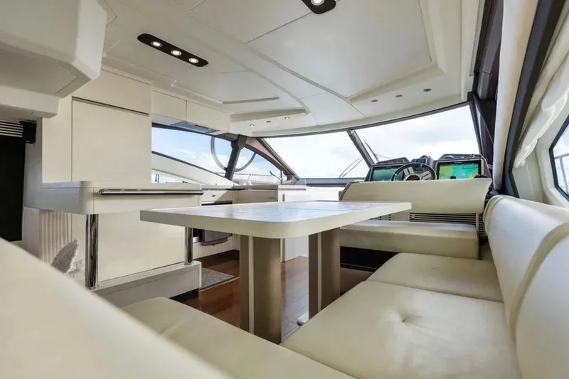 Slide: The Image of Luxurious interior of a 2016 Azimut 54 yacht with modern seating and navigation area. - 35