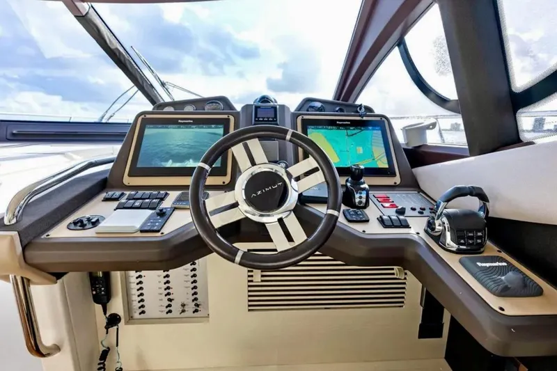 Slide: The Image of Cockpit of 2016 Azimut 54 yacht with advanced navigation systems and controls. - 36