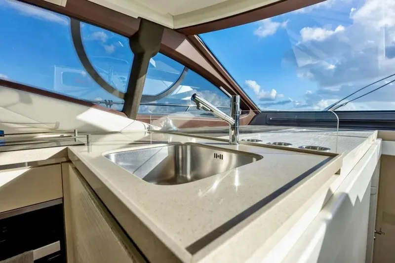Slide: The Image of Luxurious kitchen area on a 2016 Azimut 54 yacht with modern fixtures. - 38