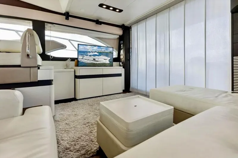 Slide: The Image of Luxurious interior of 2016 Azimut 54 yacht with modern furnishings and large windows. - 40