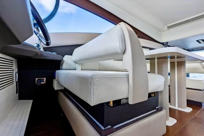 Slide: The Image of Interior of 2016 Azimut 54 yacht with modern seating and table design. - 42