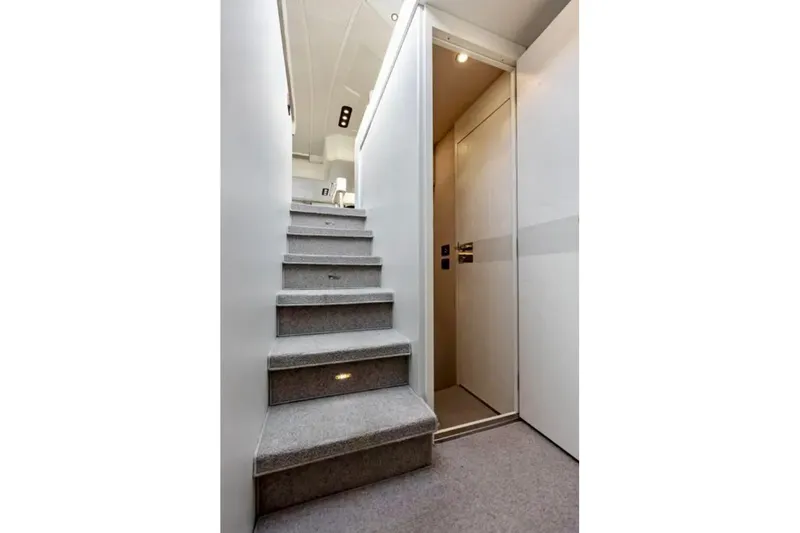 Slide: The Image of Interior staircase of 2016 Azimut 54 yacht, featuring modern design and lighting. - 43