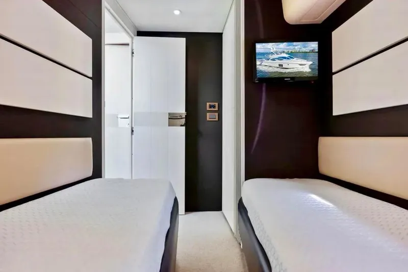 Slide: The Image of Interior of 2016 Azimut 54 yacht with twin beds and wall-mounted TV. - 50