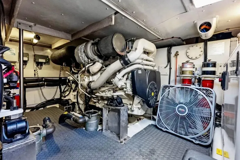 Slide: The Image of Engine room of a 2016 Azimut 54 yacht, featuring machinery and ventilation fan. - 58