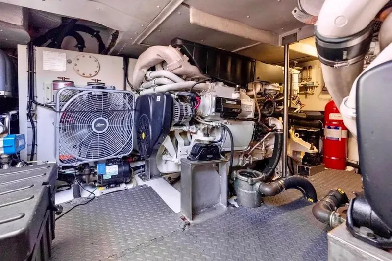 Slide: The Image of Engine room of a 2016 Azimut 54 yacht, featuring machinery and equipment. - 59