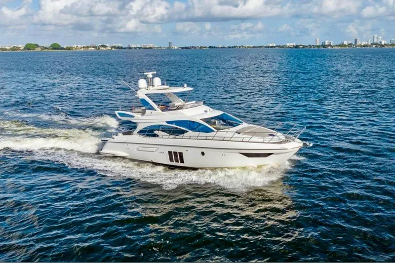 Slide: The Image of Luxurious 2016 Azimut 54 yacht cruising on open water under a clear sky. - 7