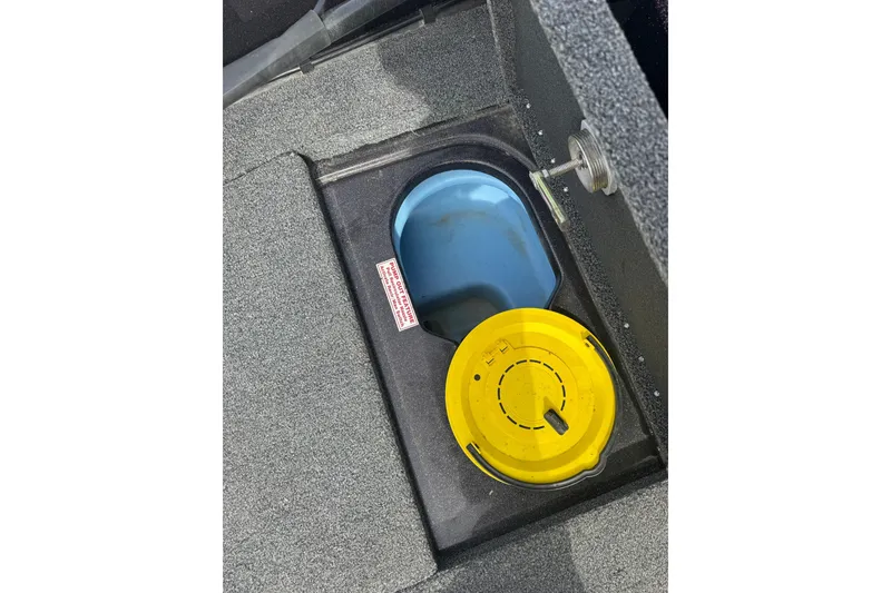 Slide: The Image of Boat storage compartment with yellow lid, Nitro ZV19 Sport 2020 model. - 17