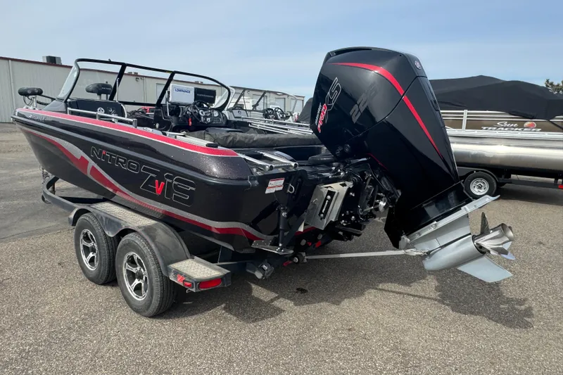 Slide: The Image of 2020 Nitro ZV19 Sport boat with powerful outboard motor on a trailer. - 4