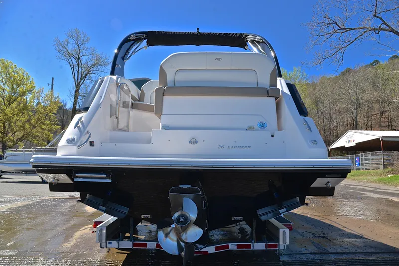 Slide: The Image of 2016 Regal 26 Express boat on trailer, rear view, outdoors. - 15