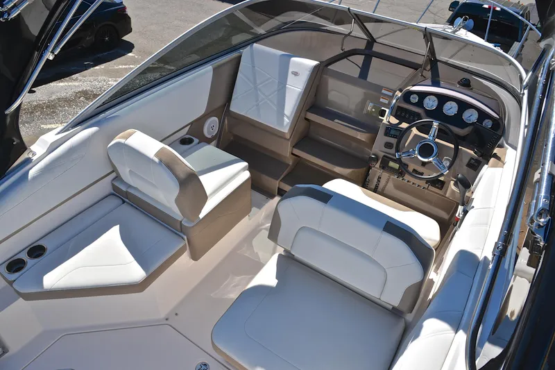 Slide: The Image of 2016 Regal 26 Express boat interior with modern dashboard and comfortable seating. - 21