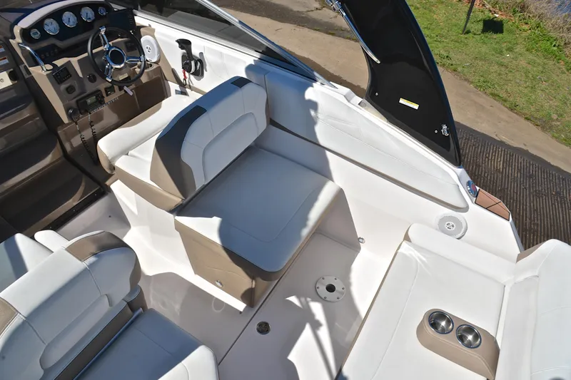 Slide: The Image of 2016 Regal 26 Express boat interior with white seating and modern dashboard. - 22