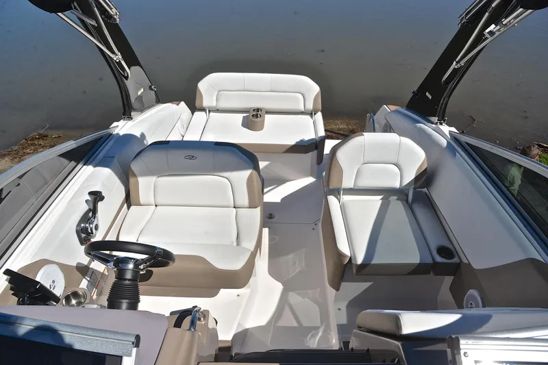 Slide: The Image of 2016 Regal 26 Express boat interior with white seating and steering wheel. - 24