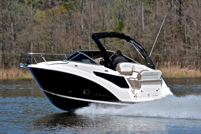Slide: The Image of 2016 Regal 26 Express boat cruising on a calm lake. - 4