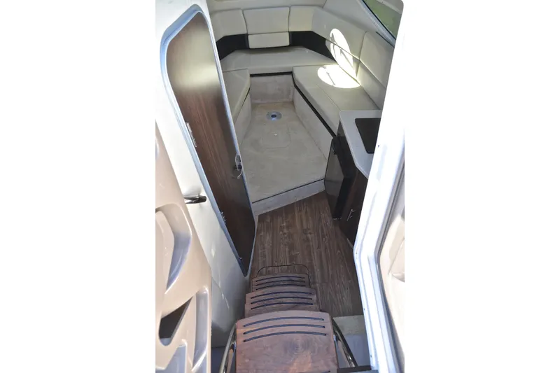 Slide: The Image of Interior of 2016 Regal 26 Express boat with seating and wooden flooring. - 40