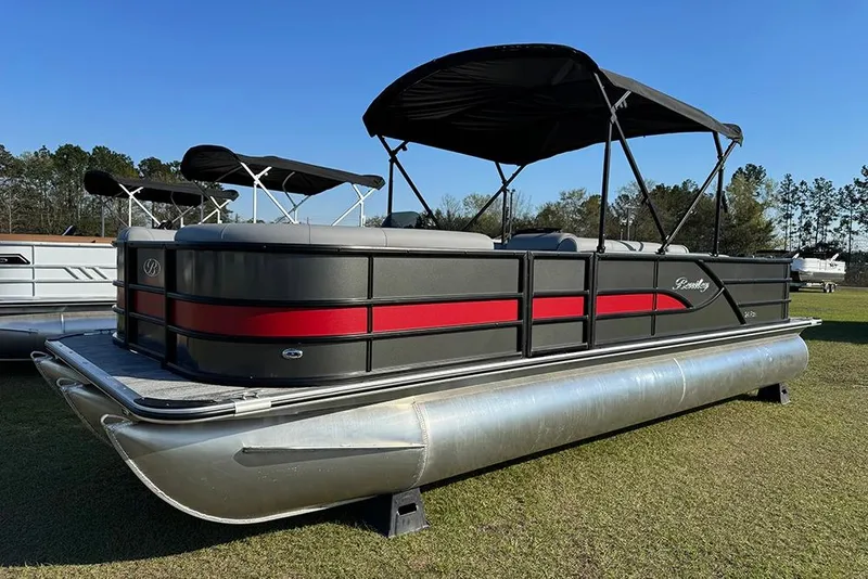 The Image of 2026 Bentley Pontoons 243 Fish-N-Cruise pontoon boat with canopy on grass. - 1
