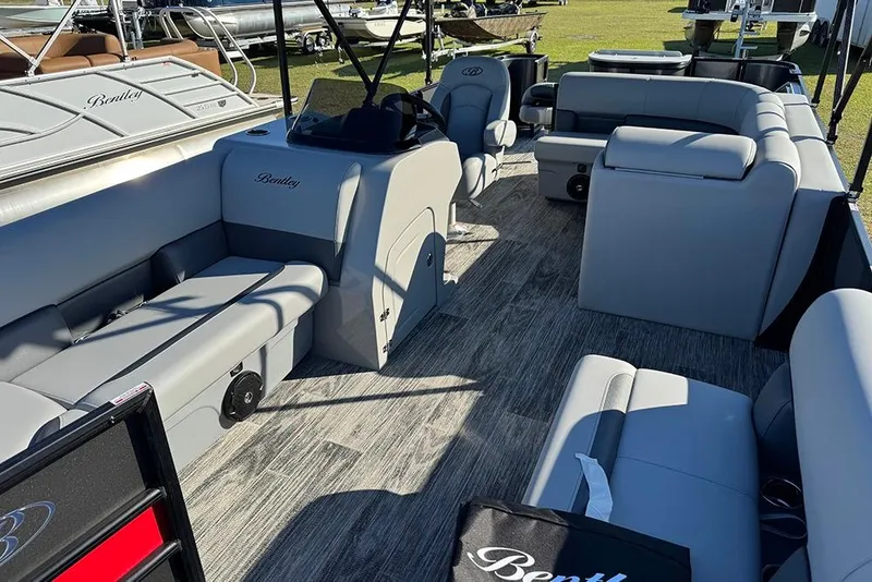 Slide: The Image of 2026 Bentley Pontoons 243 Fish-N-Cruise interior with gray seating and modern design. - 14