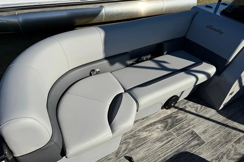 Slide: The Image of 2026 Bentley Pontoons 243 Fish-N-Cruise boat interior with sleek gray seating. - 15