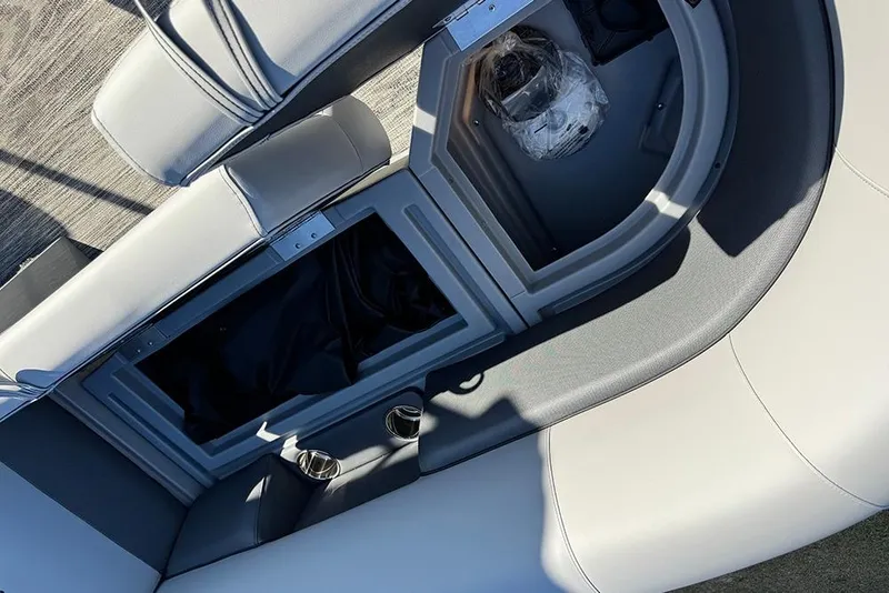 Slide: The Image of Interior seating and storage of 2026 Bentley Pontoons 243 Fish-N-Cruise boat. - 16